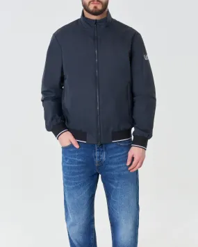 Bomber blu in nylon con bordino in contrasto e logo stampato sulla manica